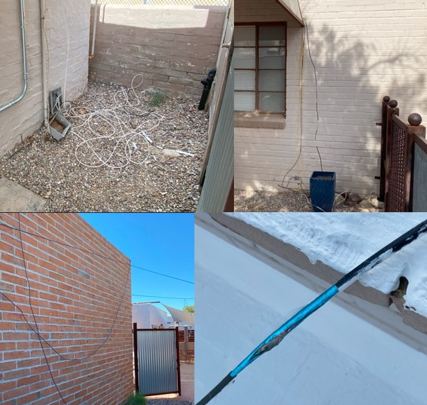 Preexisting cables hanging from building before cleanup